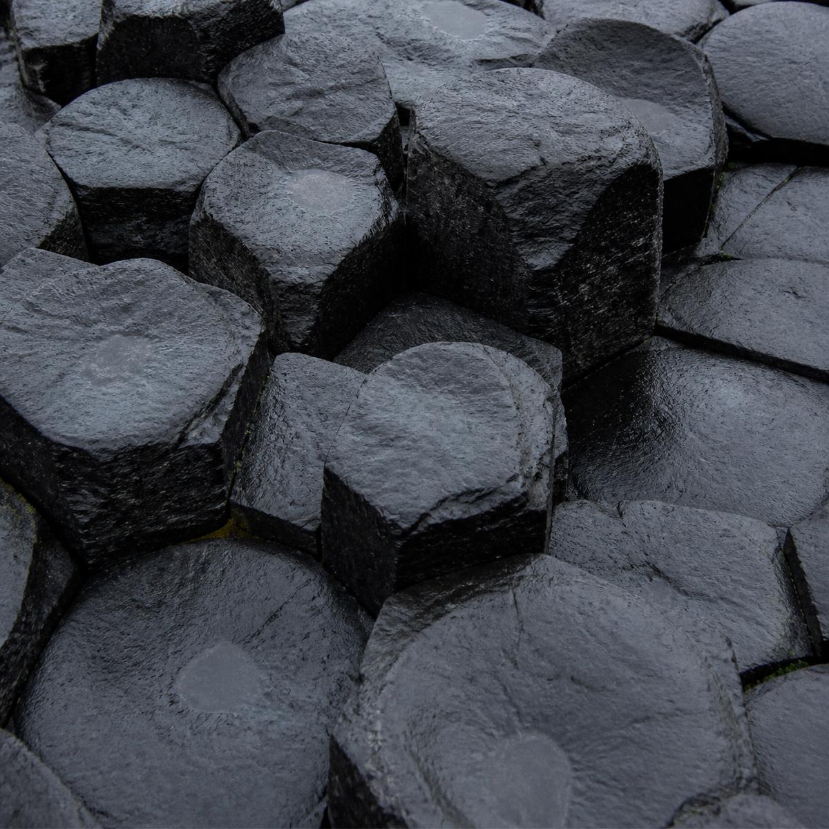 Close view of hexagonal basalt columns on an Icelandic coast